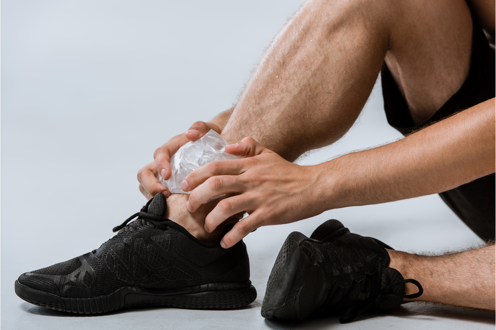 Man in sportswear with ice pack